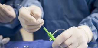 Cosmetic Surgery Skyrockets Among Men—Why Now? Medical professional preparing an intravenous catheter in a sterile setting