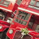 Bride DESTROYS Cheating Groom At Altar Two red double-decker buses decorated for a wedding with Just Married signs