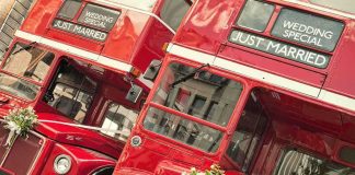 Bride DESTROYS Cheating Groom At Altar Two red double-decker buses decorated for a wedding with Just Married signs