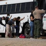 West Virginia’s Massive Immigration Sweep – 650 arrests! Border patrol officers investigating people near a bus.