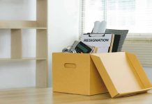 Hotel Empire COLLAPSES — Billionaire Flees Epstein Bombshell Yellow box with resignation notice on an office desk.