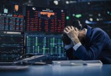 Trader stressed out by multiple declining stock charts.