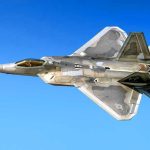 Historic Air Force-Navy Flyover Stuns Super Bowl Fighter jet in flight against a clear blue sky.
