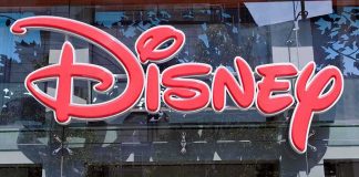 Vacuum Cleaner SHOCKER- Airbnb Host ARRESTED Near Disney Bright red Disney logo displayed on a storefront window