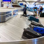 Spring Breakers UNLEASH Bed Bug PLAGUE — Yikes! Luggage on airport baggage claim conveyor belt.