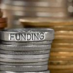 Trump DESTROYS Biden’s $1.7 Trillion Stranglehold Stack of coins labeled funding with other coins stacks