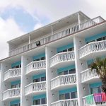 FBI Hostage Team Storms Florida Hotel Room Exterior view of a beachfront hotel with balconies and colorful towels hanging