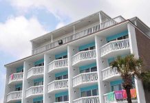 FBI Hostage Team Storms Florida Hotel Room Exterior view of a beachfront hotel with balconies and colorful towels hanging