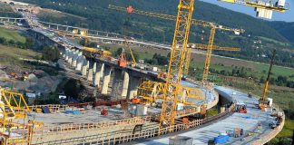 Construction of a large bridge with cranes and machinery in operation