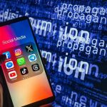 Smartphone showing social media apps with text background.