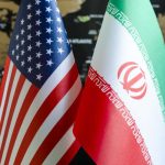 Peace Promised YET Nukes Keep Running Flags of the United States and Iran displayed together