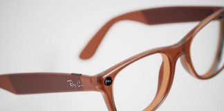 Brown plastic eyeglasses with clear lenses on a white background