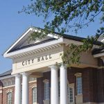 MYSTERY Order — CITY HALL YANKS Flag Before FIREWORKS City Hall building with columns and a tree branch.