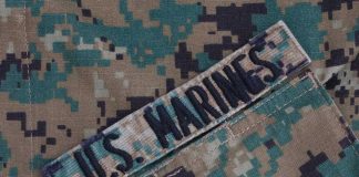 US Marines patch on camouflage uniform fabric