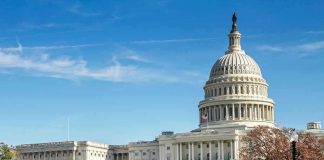 United States Capitol building with dome and autumn trees