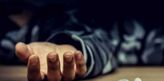 Nine Overdoses, Silence — WHO ARE THEY PROTECTING?? People seated at a table filling out forms in a bright office