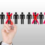 Hard LOSS, Poor LOSER, Racist ACCUSATIONS EXPLODE! A hand using a red marker to cross out human figures in a selection process