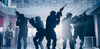 REPORT UPDATE — Morning FIREBOMB DETAILS Tactical police team advances through a smoky office building