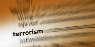Blurred text with the word 'terrorism' in focus