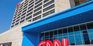 CNN Meltdown EXPOSES Party Protection RACKET Exterior view of the CNN headquarters with a large red logo and blue entrance
