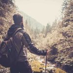 SKEWERED Nurse Walks 10 Miles OUT! A hiker standing in a forest, looking at a scenic view of mountains and trees