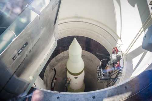 View of a missile inside a silo with maintenance equipment