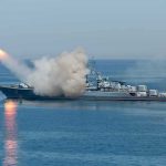 Warship launching a missile at sea