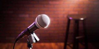 Microphone on stand with stool in blurred background