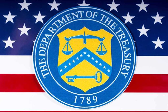 shutterstock_1054857707 U.S. Department of the Treasury seal over American flag