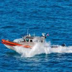 coast guard patrol boat speeding across open ocean