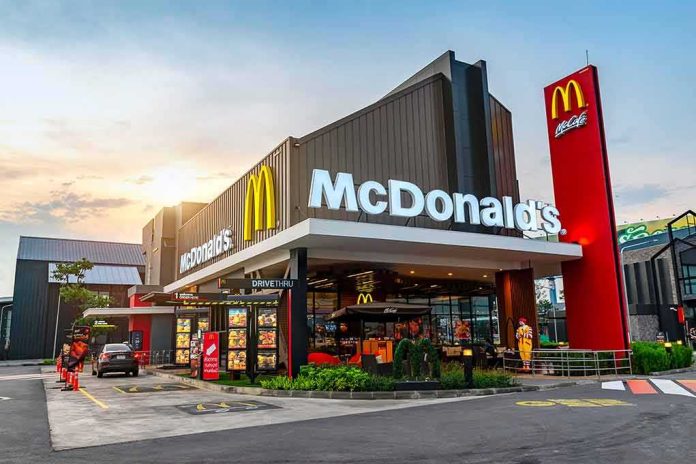 McDonald's restaurant exterior with drive-thru at sunset