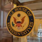 U.S. House of Representatives seal on a glass door