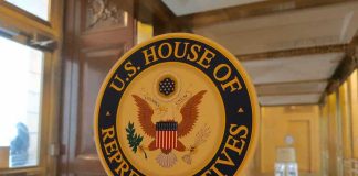 U.S. House of Representatives seal on a glass door