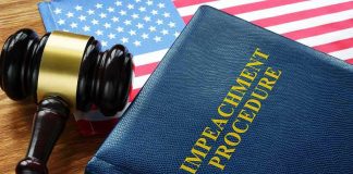 Impeachment procedure book with gavel and U.S. flag