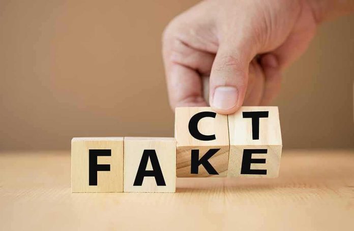 Hand flipping wooden blocks between fact and fake