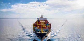 Container ship sailing on calm ocean