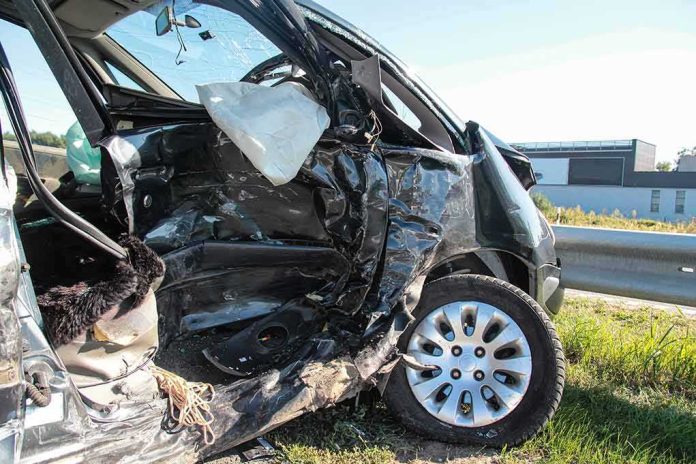 Crashed car with severe side damage and deployed airbag