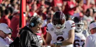 Touchdown Joy Turns TRAGIC football coach and quarterback confer on sideline