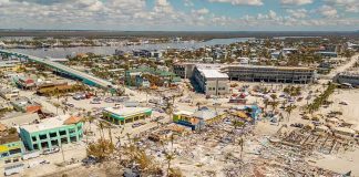 Aerial view of coastal town with widespread storm damage