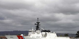 Retaliation BOMBSHELL Inside Coast Guard A U.S. Coast Guard ship docked under cloudy skies