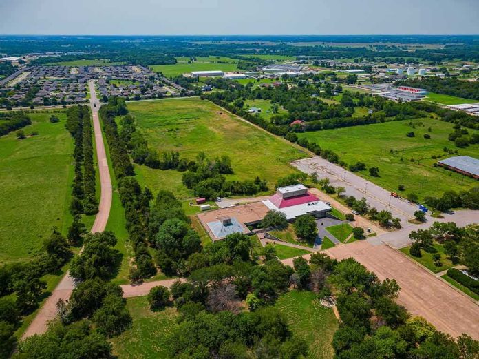 Aerial view of rural landscape with roads, fields, and scattered buildings