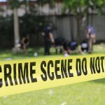 Home RAID Revealed UNTHINKABLE DISCOVERY crime scene tape cordoning off a grassy area