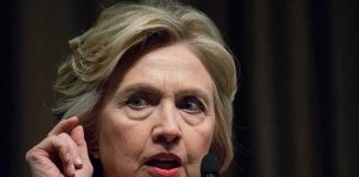woman speaking at microphones