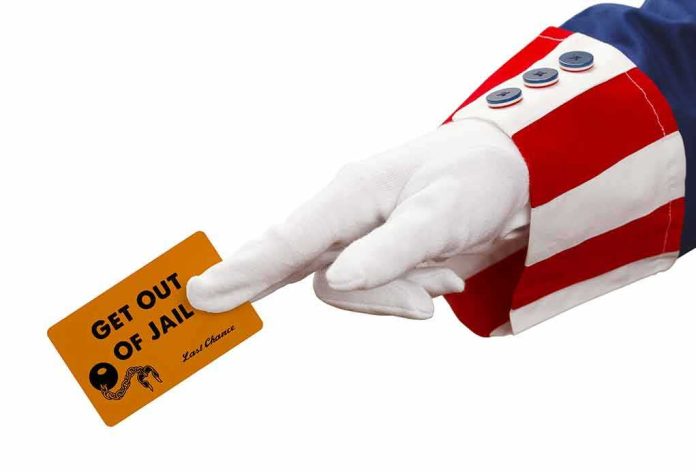 gloved hand in red and white striped sleeve holding a get out of jail card