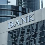 Trump FAMILY Crypto BANK — GREENLIT Bank building facade with large sign and glass windows