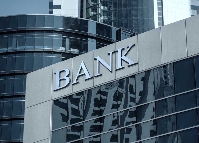 shutterstock_574713295-4- Bank building facade with large sign and glass windows