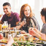 friends gathered at a table sharing a meal