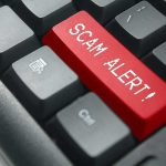 Keyboard with red scam alert key