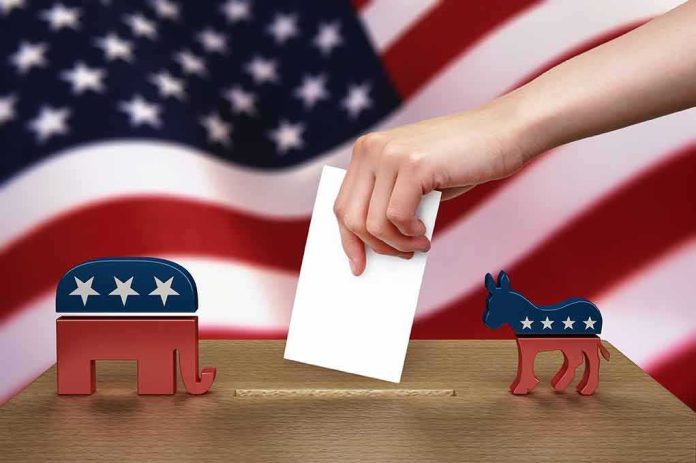Hand casting ballot between Republican elephant and Democratic donkey