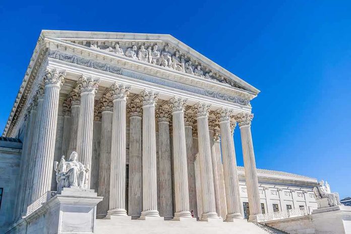 shutterstock_1113490121 Supreme Court building with tall marble columns under a clear blue sky